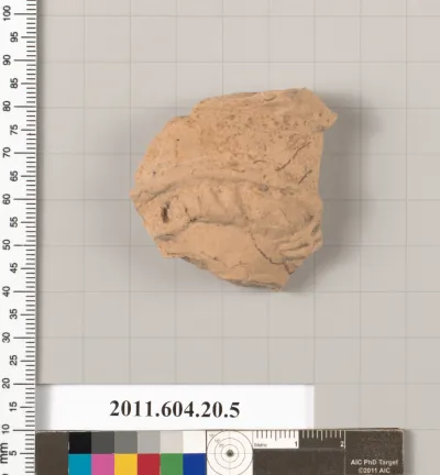 Fragment of a statuette of a woman