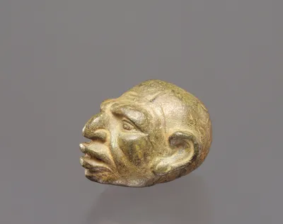 Weight in the Form of a Grotesque Head