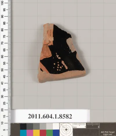 Terracotta fragment of a stemless kylix (drinking cup)