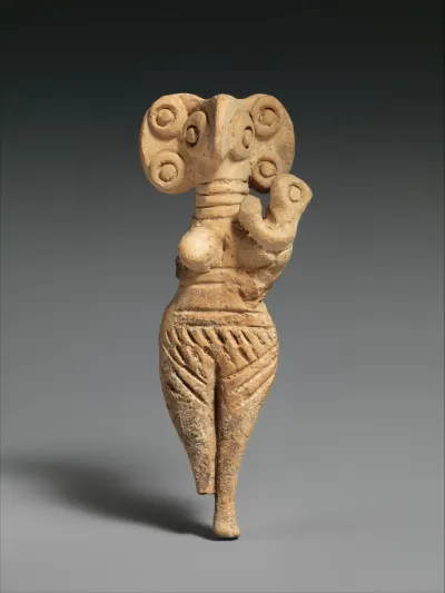 Terracotta statuette of woman with bird face