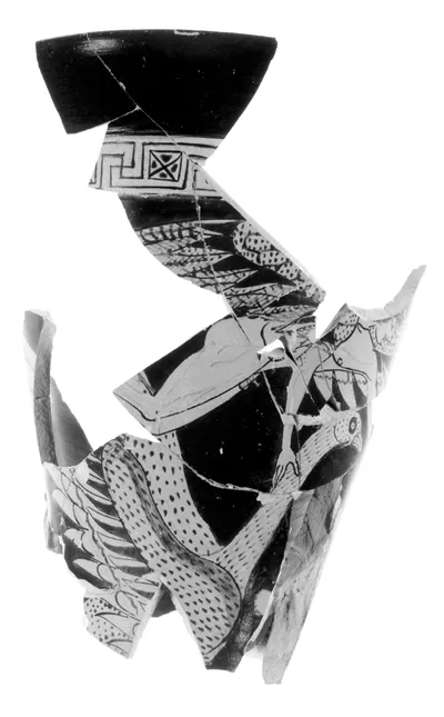 Fragment of an Attic Red-Figure Vase in the form of a Satyr holding a Keras (comprised of 20 joined fragments)