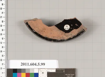 Terracotta fragment of a stemless kylix (drinking cup)