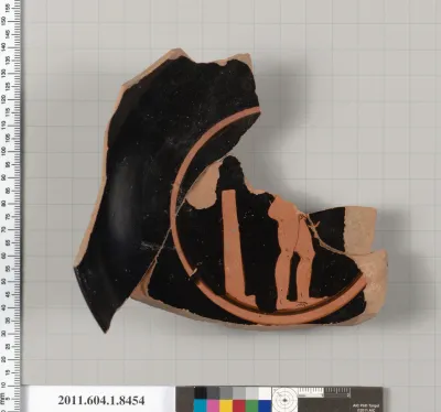Terracotta fragment of a stemless kylix (drinking cup)