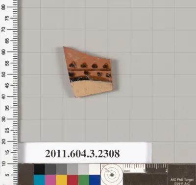 Terracotta fragment of a kylix: eye-cup (drinking cup)