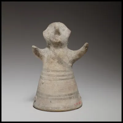 Standing male figurine with uplifted arms