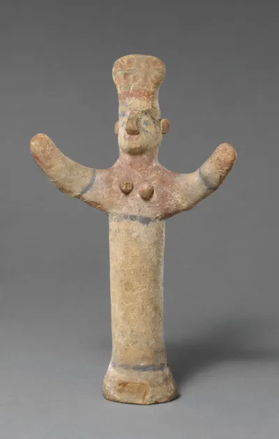 Standing female figurine of the "goddess with uplifted arms" type