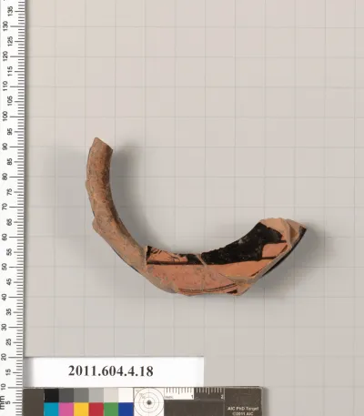 Terracotta fragment of a stemless kylix (drinking cup)