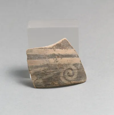 Terracotta rim fragment with running spiral