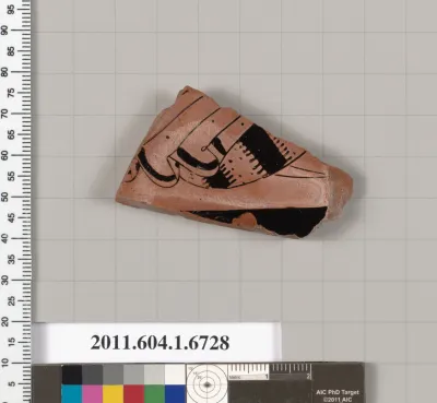 Terracotta fragment of a kylix (drinking cup)