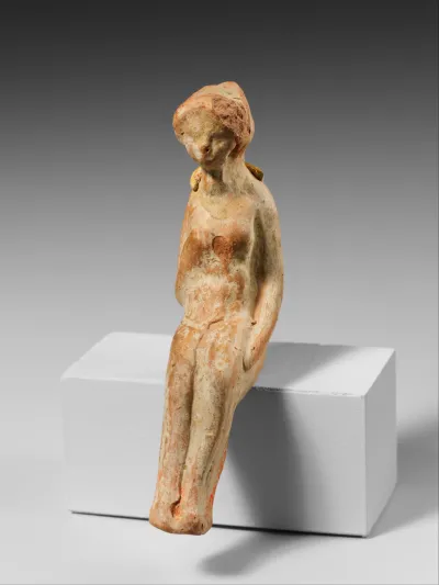 Terracotta statuette of a seated woman