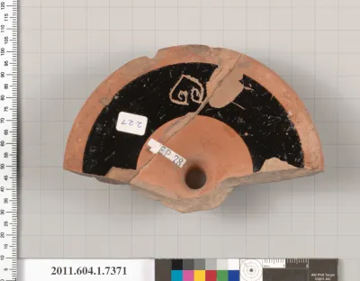 Terracotta fragment of a kylix (drinking cup)