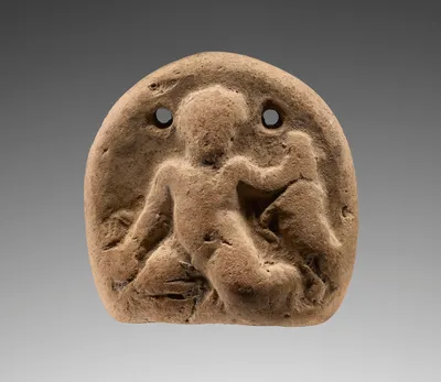 Loom Weight with (A) Two Confronting Heads and (B) Infant Herakles
