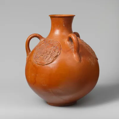 Three-handled jug with relief medallions