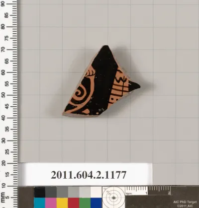 Terracotta fragment of a lekanis lid (covered dish)