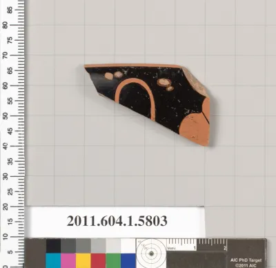Terracotta fragment of a kylix: eye-cup  (drinking cup)