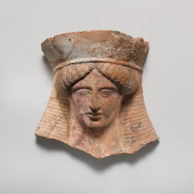 Terracotta relief head of a woman