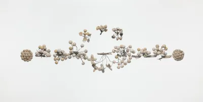 Gilt terracotta wreath with flowers and berries