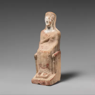 Terracotta statuette of a seated woman