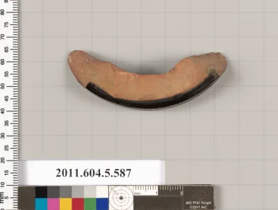 Terracotta fragment of a stemless kylix (drinking cup)