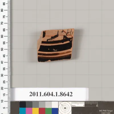 Terracotta fragment of a stemless kylix (drinking cup)