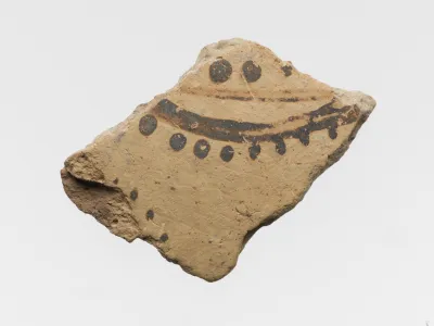 Terracotta vessel fragment with floral or marine motif