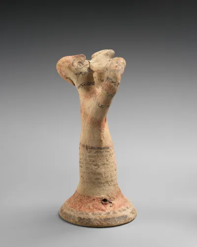 Terracotta statuette of a male flute-player