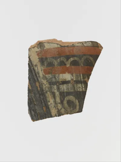 Terracotta fragment of a cup with spiral and bands