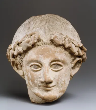 Terracotta head of a wreathed youth
