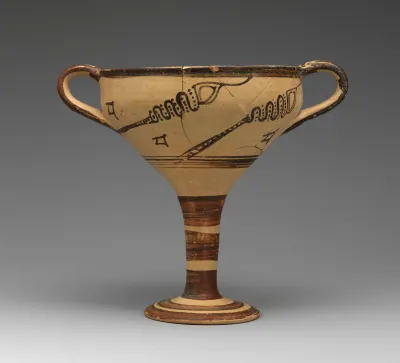 Terracotta stemmed cup with murex decoration