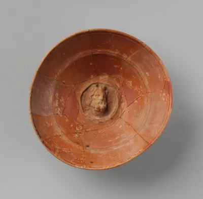 Terracotta emblem bowl with head of Zeus or Sarapis