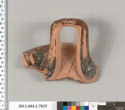 Terracotta fragment of a kylix (drinking cup)