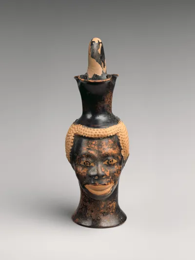 Terracotta oinochoe (jug) in the form of a Black African's head