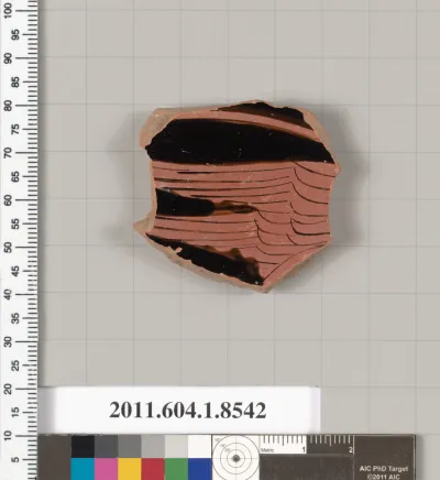 Terracotta fragment of a stemless kylix (drinking cup)