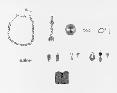 Group of Fourteen Ancient Gold Jewelry Fragments and One Encrusted Glass Pendant