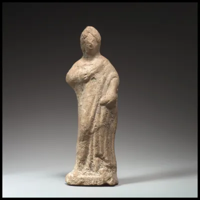 Terracotta statuette of a woman standing