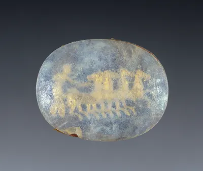 Glass gem with gold foil ornament