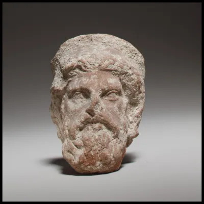 Terracotta head of a bearded god, perhaps Zeus