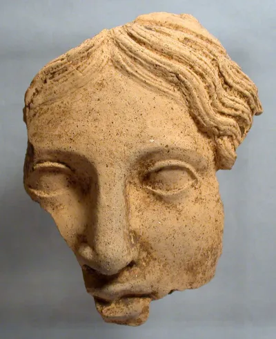 Fragmentary terracotta female head