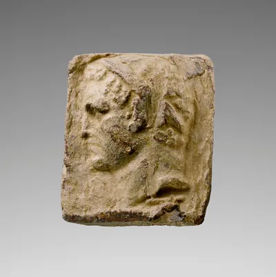 Weight with Head of a Beardless Male