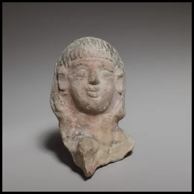 Female head, perhaps from a standing tambourine player