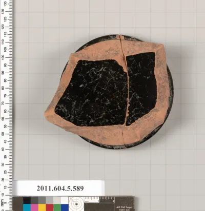 Terracotta fragment of a stemless kylix (drinking cup)