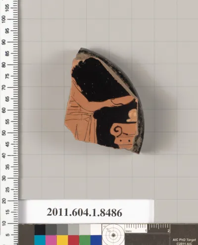 Terracotta fragment of a stemless kylix (drinking cup)