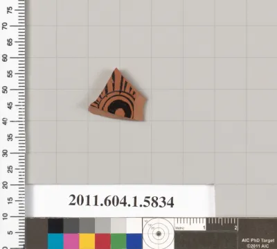 Terracotta fragment of a kylix: eye-cup  (drinking cup)