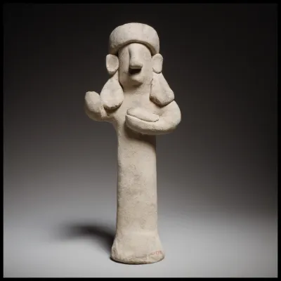 Standing male(?) figurine holding a bird