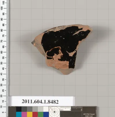 Terracotta fragment of a stemless kylix (drinking cup)
