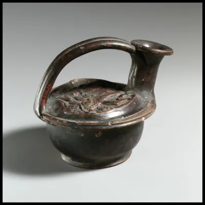 Terracotta askos (flask with a spout and handle over the top)