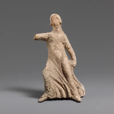 Terracotta statuette of a girl dancing