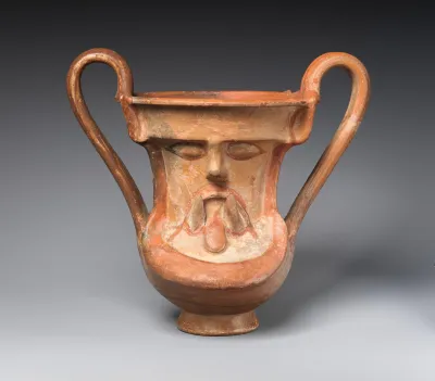 Terracotta kantharos (wine cup) with a satyr's mask on both sides
