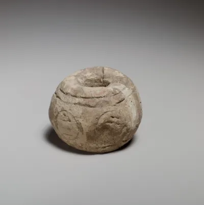 Spherical spindle-whorl with broad top and base