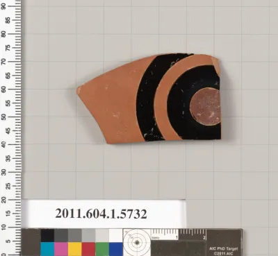 Terracotta fragment of a kylix: eye-cup  (drinking cup)